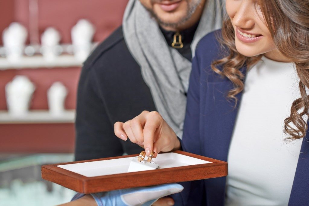 Couple buying wedding ring
