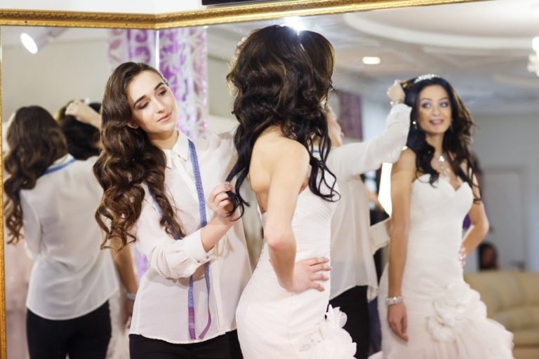 Female trying on wedding dress