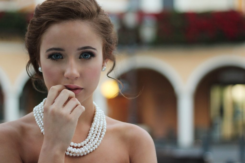 attractive woman wearing a pearl necklace