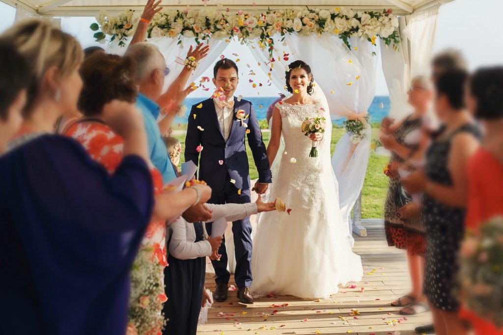 smiling newlyweds on the luxury outdoor wedding ceremony