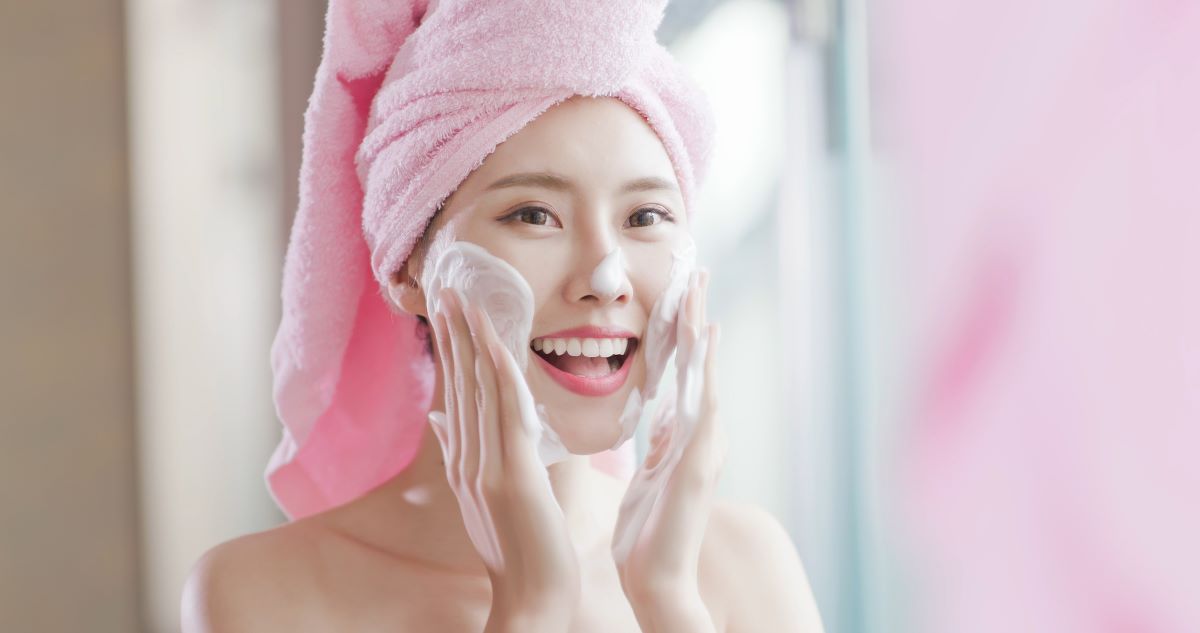 woman applying facial products