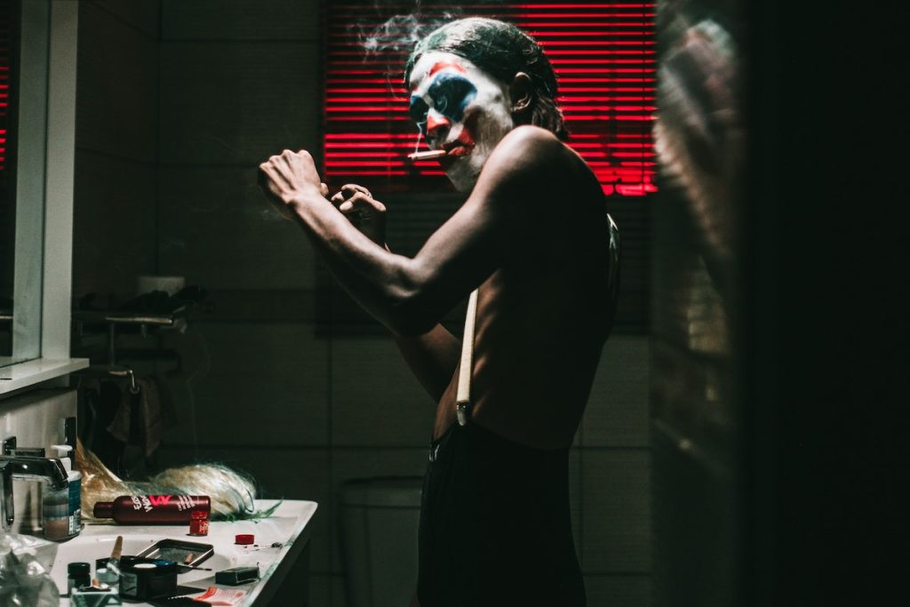 Man Wearing Joker Face Paint