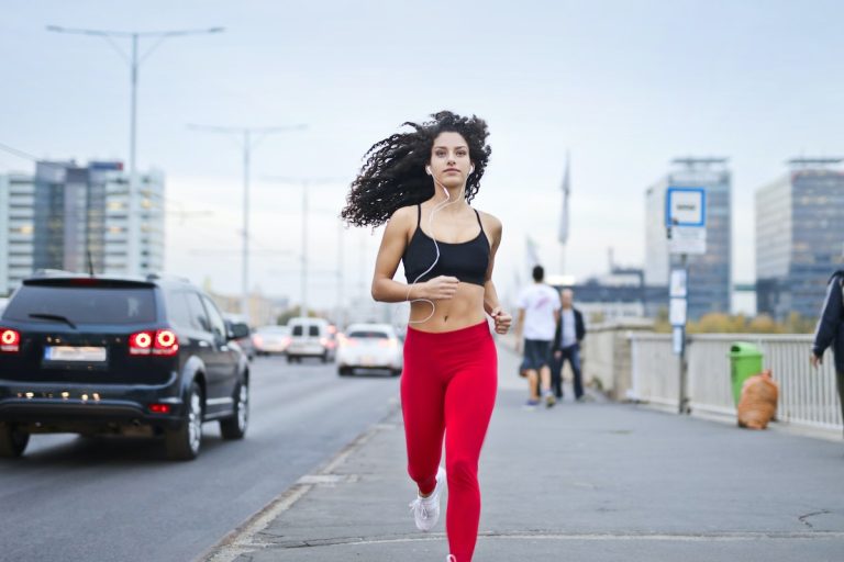 woman in red track suit running