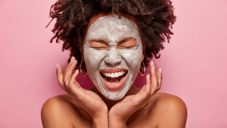 woman with face mask smiling