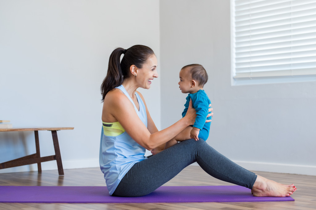mother exercising with baby boy